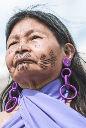 elderly woman wearing sustainable jewellery